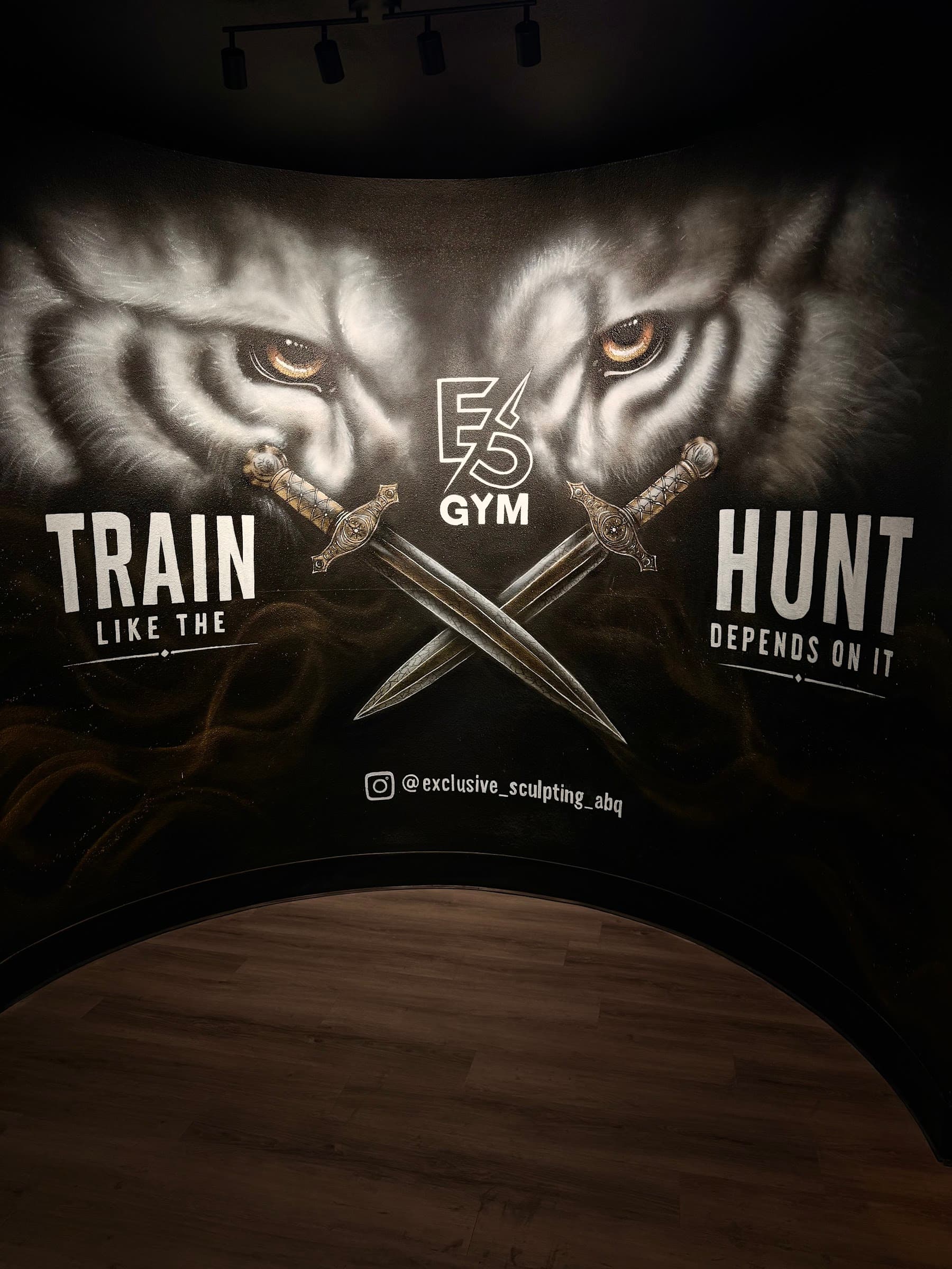 Train like the hunt depends on it mural